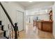 Foyer with tiled floors, adjacent to a bar area and staircase at 4569 Chatsworth Ovrlk Ne, Roswell, GA 30075