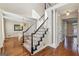 Grand foyer with hardwood floors, staircase, and elegant architectural details at 4569 Chatsworth Ovrlk Ne, Roswell, GA 30075