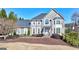 Charming two-story home with well-manicured front yard and inviting entrance at 4569 Chatsworth Ovrlk Ne, Roswell, GA 30075