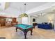 Game room features a pool table with a bar area and sitting area at 4569 Chatsworth Ovrlk Ne, Roswell, GA 30075