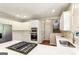 Modern kitchen with stainless steel appliances, quartz countertops, and gas cooktop at 4569 Chatsworth Ovrlk Ne, Roswell, GA 30075