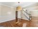 Classic living room with hardwood floors, staircase, and plenty of natural light at 4569 Chatsworth Ovrlk Ne, Roswell, GA 30075