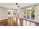 Bright, open living room with hardwood floors and large windows overlooking a deck at 4569 Chatsworth Ovrlk Ne, Roswell, GA 30075