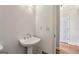 Traditional powder room with pedestal sink and gold-tone faucet at 4569 Chatsworth Ovrlk Ne, Roswell, GA 30075