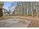 Spacious backyard with tall trees and wood fence at 12241 Crestwood Ct, Fayetteville, GA 30215