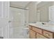 Bathroom featuring a shower-tub combo, toilet, and vanity with white countertop at 12241 Crestwood Ct, Fayetteville, GA 30215