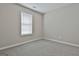 Bedroom with neutral carpet, a single window, and light gray walls at 12241 Crestwood Ct, Fayetteville, GA 30215