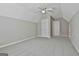 Bedroom with carpet, ceiling fan, and two closet doors at 12241 Crestwood Ct, Fayetteville, GA 30215