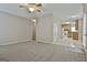 Open living room showing flow into kitchen at 12241 Crestwood Ct, Fayetteville, GA 30215