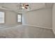 Spacious main bedroom with ceiling fan and tray ceiling at 12241 Crestwood Ct, Fayetteville, GA 30215