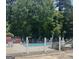 Community pool area with a wrought iron fence for safety and rules for guests to follow at 12241 Crestwood Ct, Fayetteville, GA 30215