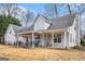 Rear view of home featuring covered patio, well-manicured lawn, and plenty of space for activities at 149 Crown Oaks Dr, Stockbridge, GA 30281