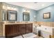 Well-lit primary bathroom with double vanity, soaking tub and tile flooring at 149 Crown Oaks Dr, Stockbridge, GA 30281
