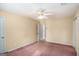 Neutral bedroom featuring standard closet, ceiling fan and natural light at 149 Crown Oaks Dr, Stockbridge, GA 30281
