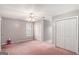Bedroom featuring neutral walls, a ceiling fan, and ample closet space for storage at 149 Crown Oaks Dr, Stockbridge, GA 30281