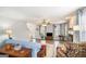 Open-concept living room with fireplace, hardwood floors, and plenty of natural light at 149 Crown Oaks Dr, Stockbridge, GA 30281