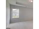 Well-lit bedroom showcases a window and soothing neutral tones at 127 Felicity Pike, Locust Grove, GA 30248