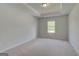A serene bedroom features plush carpeting and ample natural light at 127 Felicity Pike, Locust Grove, GA 30248