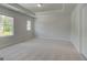 Sunlit bedroom boasts plush carpeting and a tray ceiling at 127 Felicity Pike, Locust Grove, GA 30248