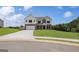 Two-story home with a brick and white shingle exterior, two-car garage, and lush green lawn at 127 Felicity Pike, Locust Grove, GA 30248