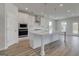 Modern kitchen featuring a large island and stainless steel appliances at 127 Felicity Pike, Locust Grove, GA 30248