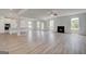 Large open-concept living room with hardwood floors and fireplace at 127 Felicity Pike, Locust Grove, GA 30248