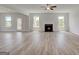 Bright living room with a cozy fireplace and outdoor access at 127 Felicity Pike, Locust Grove, GA 30248