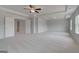 Spacious main bedroom features neutral decor, tray ceiling, and plush carpeting at 127 Felicity Pike, Locust Grove, GA 30248