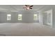 Expansive main bedroom features tray ceiling and multiple windows at 127 Felicity Pike, Locust Grove, GA 30248