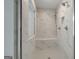 Stunning marble shower featuring a bench, sleek fixtures, and natural light at 127 Felicity Pike, Locust Grove, GA 30248