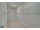 Spacious walk-in closet featuring neutral carpet and white wire shelving at 127 Felicity Pike, Locust Grove, GA 30248