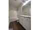 Well-lit bathroom with a tub-shower combo and granite-topped vanity at 11144 Cornerstone Way, Hampton, GA 30228