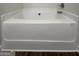 A close-up view of the bathroom's sleek white bathtub at 11144 Cornerstone Way, Hampton, GA 30228