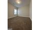 Comfortable bedroom featuring neutral carpet, a large window, and ample space for furnishings at 11144 Cornerstone Way, Hampton, GA 30228