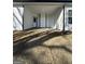 Covered back patio with black and white finishes at 11144 Cornerstone Way, Hampton, GA 30228