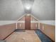 Unfinished bedroom featuring a vaulted ceiling and an open design, offering potential for customization and renovation at 114 Mcbride Rd, Fayetteville, GA 30215