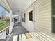Inviting covered front porch, perfect for relaxing and enjoying the outdoors with a view to the yard at 114 Mcbride Rd, Fayetteville, GA 30215