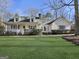 Charming single-Gathering home boasts a well-maintained lawn, covered porch and traditional design elements at 114 Mcbride Rd, Fayetteville, GA 30215