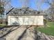 Spacious detached two-car garage featuring a wide driveway and ample parking space for vehicles at 114 Mcbride Rd, Fayetteville, GA 30215