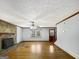 Spacious living room with hardwood flooring, fireplace, and natural light streaming through the windows at 114 Mcbride Rd, Fayetteville, GA 30215