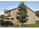 View of the home's side showing siding, stone accents, and lush green landscaping at 6001 Nile Ct, Atlanta, GA 30349