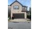 Beautiful two-story home boasts a spacious two-car garage and well-maintained landscaping at 6001 Nile Ct, Atlanta, GA 30349