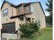 Exterior view showing a combination of brick and siding on a charming two-story home at 6001 Nile Ct, Atlanta, GA 30349