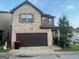 Charming two-story home with a brick and stone facade, plus an attached garage at 6001 Nile Ct, Atlanta, GA 30349