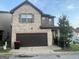 Charming two-story home with a brick and stone facade, plus an attached garage at 6001 Nile Ct, Atlanta, GA 30349
