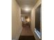 Inviting hallway leads to a living room featuring a fireplace and plush seating at 6001 Nile Ct, Atlanta, GA 30349