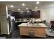 Spacious kitchen with dark cabinetry, granite countertops, and stainless steel appliances at 6001 Nile Ct, Atlanta, GA 30349