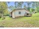 Backyard view of property with deck, lush green lawn and treed backdrop at 4481 Mclain Cir, Acworth, GA 30101