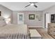 Bright bedroom featuring a bed, a chest of drawers, and a door leading to an outdoor space at 4481 Mclain Cir, Acworth, GA 30101