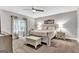 This bedroom includes a large bed, window with curtains, and neutral decor at 4481 Mclain Cir, Acworth, GA 30101